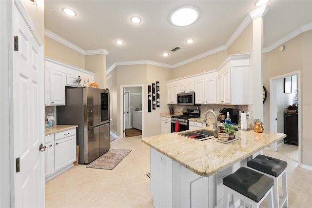 8737 SW 83rd Cir, Ocala, FL 34481 - kitchen featuring appliances with stainless steel finishes, a sink, a peninsula, decorative backsplash, and ornamental molding