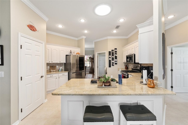 8737 SW 83rd Cir, Ocala, FL 34481 - kitchen with stainless steel appliances, a peninsula, backsplash, white cabinetry, and crown molding