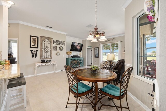 8737 SW 83rd Cir, Ocala, FL 34481 - dining area with a chandelier, ornamental molding, baseboards, and light tile patterned floors