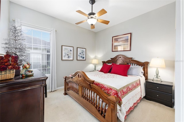 8737 SW 83rd Cir, Ocala, FL 34481 - bedroom with light carpet, a ceiling fan, and baseboards