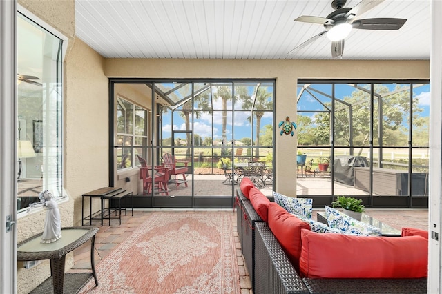 8737 SW 83rd Cir, Ocala, FL 34481 - sunroom / solarium with ceiling fan and outdoor lounge area