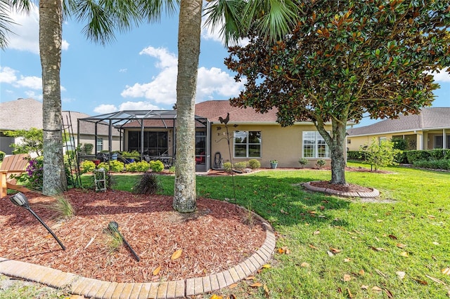 8737 SW 83rd Cir, Ocala, FL 34481 - back of house with stucco siding, a yard, and a lanai