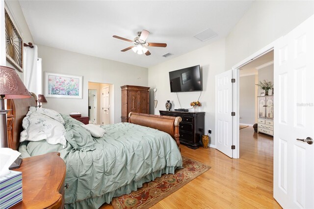 8737 SW 83rd Cir, Ocala, FL 34481 - bedroom with light wood-style flooring and a ceiling fan