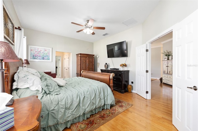 8737 SW 83rd Cir, Ocala, FL 34481 - bedroom with light wood-style flooring and a ceiling fan