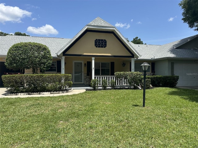 8801 SW 92nd St Unit B, Ocala, FL 34481 - view of front of property featuring a porch, an attached garage, a front lawn, stucco siding, and a shingled roof