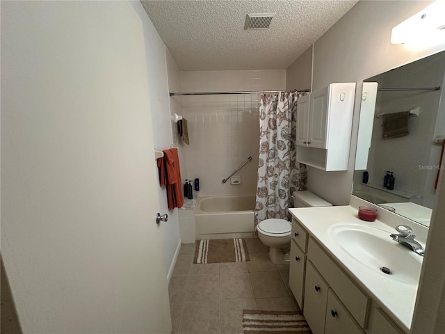 8801 SW 92nd St Unit B, Ocala, FL 34481 - full bath with vanity, toilet, shower / bath combo with shower curtain, a textured ceiling, and tile patterned flooring