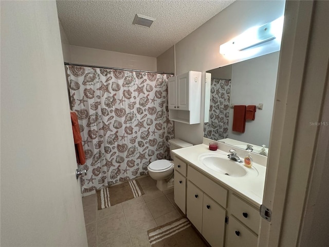 8801 SW 92nd St Unit B, Ocala, FL 34481 - full bath featuring vanity, toilet, a textured ceiling, tile patterned floors, and a shower with shower curtain
