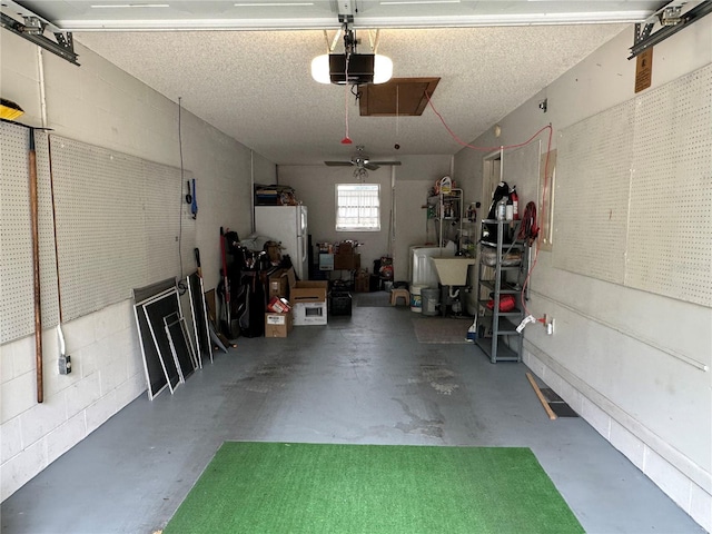 8801 SW 92nd St Unit B, Ocala, FL 34481 - garage with a garage door opener and freestanding refrigerator