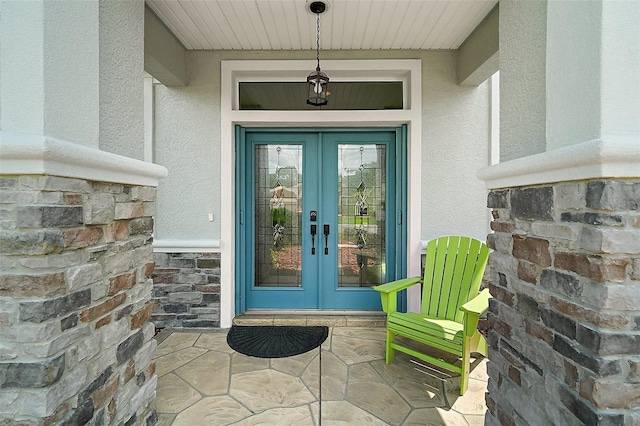 8772 SE 130th Loop, Summerfield, FL 34491 - property entrance featuring french doors, stucco siding, and stone siding