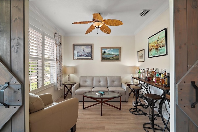 8772 SE 130th Loop, Summerfield, FL 34491 - living room featuring light wood-type flooring, healthy amount of natural light, ceiling fan, and ornamental molding