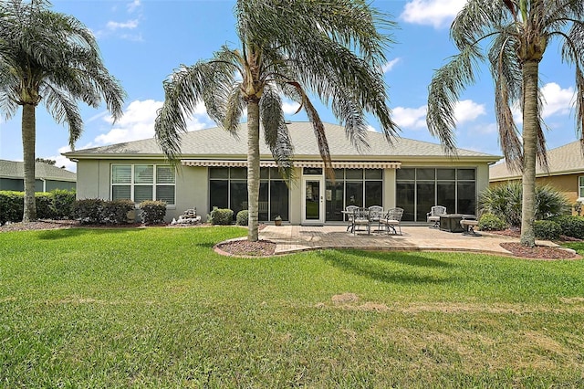 8772 SE 130th Loop, Summerfield, FL 34491 - rear view of house with a patio, a yard, stucco siding, and a sunroom