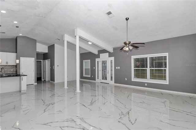 14550 SW 61st Ct, Ocala, FL 34473 - unfurnished living room with vaulted ceiling, ceiling fan, baseboards, recessed lighting, and light marble finish floors
