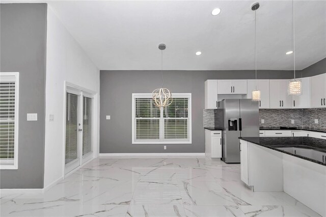 14550 SW 61st Ct, Ocala, FL 34473 - kitchen with stainless steel fridge with ice dispenser, white cabinets, dark countertops, tasteful backsplash, and recessed lighting