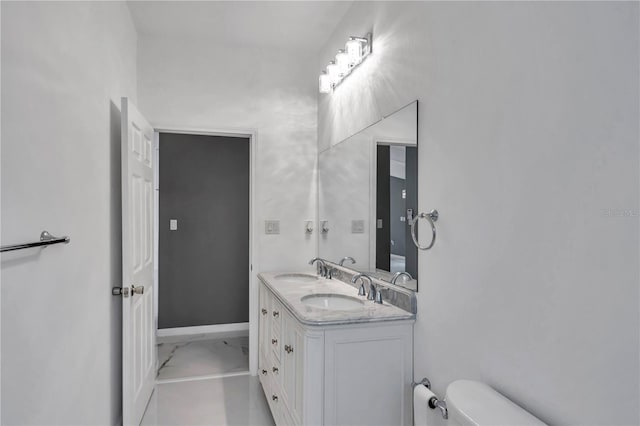 14550 SW 61st Ct, Ocala, FL 34473 - bathroom featuring toilet, double vanity, and marble finish floors