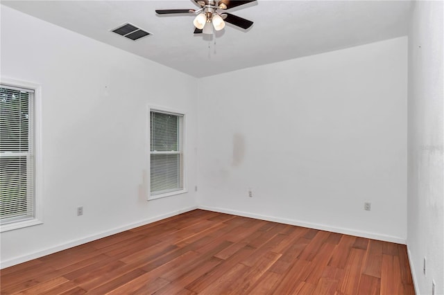 14550 SW 61st Ct, Ocala, FL 34473 - spare room featuring a ceiling fan, wood finished floors, and baseboards