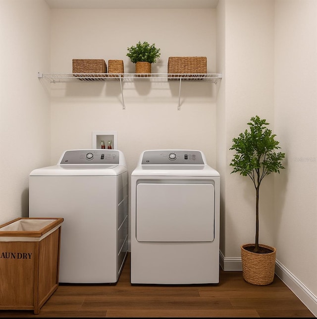 3529 SW 150th Ct, Dunnellon, FL 34432 - laundry area featuring separate washer and dryer, wood finished floors, and baseboards
