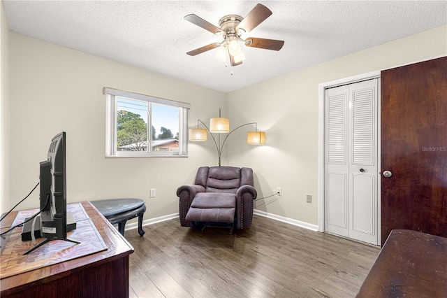 5005 NE 22nd Ave, Ocala, FL 34479 - home office with a ceiling fan, wood finished floors, baseboards, and a textured ceiling