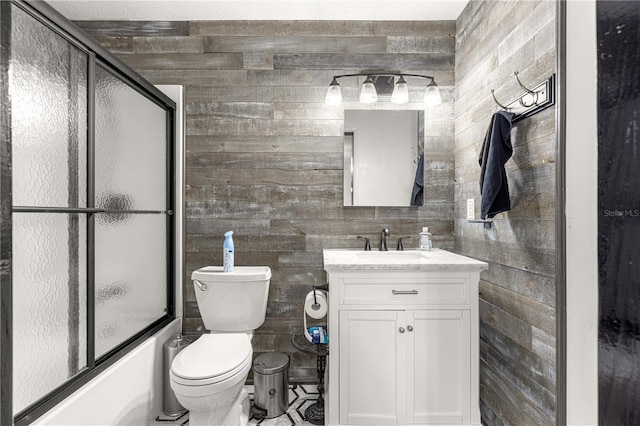 5005 NE 22nd Ave, Ocala, FL 34479 - bathroom featuring vanity, toilet, bath / shower combo with glass door, and wood walls