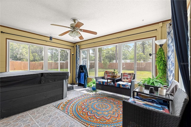 5005 NE 22nd Ave, Ocala, FL 34479 - sunroom / solarium with a jacuzzi, a ceiling fan, and an outdoor hangout area