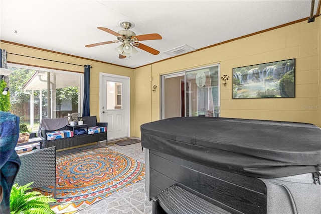 5005 NE 22nd Ave, Ocala, FL 34479 - sunroom with a jacuzzi, ceiling fan, and outdoor lounge area
