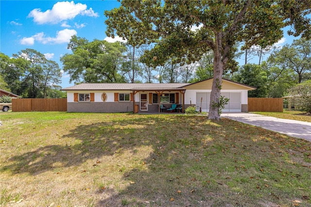 5005 NE 22nd Ave, Ocala, FL 34479 - ranch-style house with concrete driveway, an attached garage, and a porch