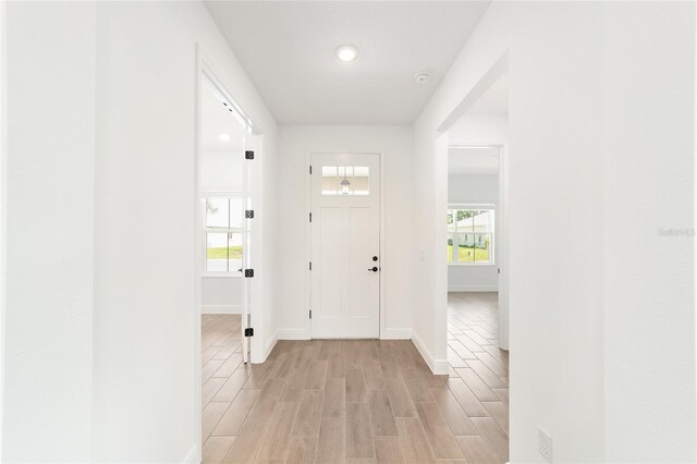 10562 SW 96th Lane Rd, Ocala, FL 34481 - foyer entrance with light wood-style flooring, baseboards, and recessed lighting