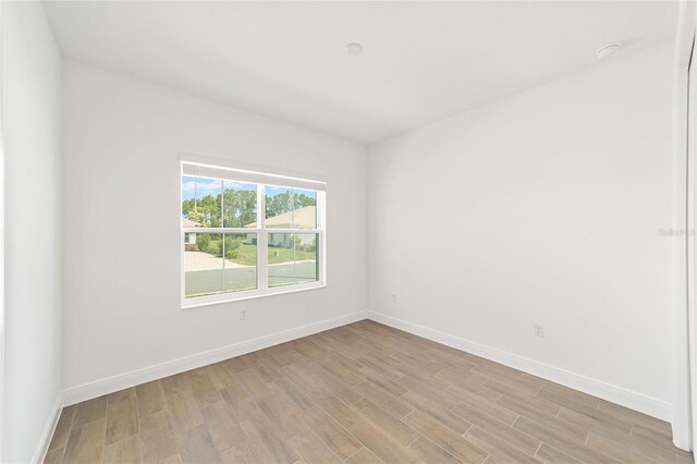 10562 SW 96th Lane Rd, Ocala, FL 34481 - spare room featuring light wood-style flooring and baseboards