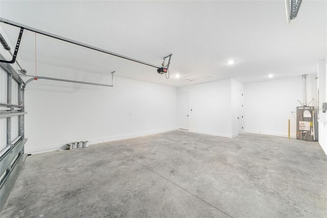 10562 SW 96th Lane Rd, Ocala, FL 34481 - garage featuring water heater, recessed lighting, a garage door opener, and baseboards