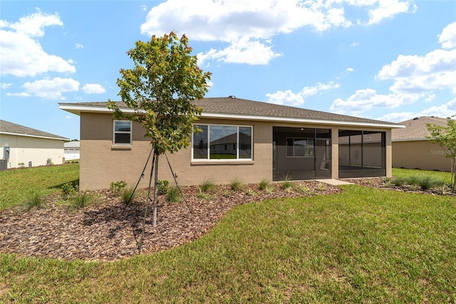 10562 SW 96th Lane Rd, Ocala, FL 34481 - rear view of house featuring a sunroom, stucco siding, and a yard