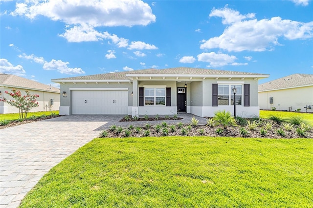 9865 SW 105th Ct, Ocala, FL 34481 - ranch-style home with stucco siding, a garage, decorative driveway, and a front lawn