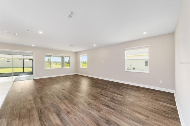 9865 SW 105th Ct, Ocala, FL 34481 - spare room with wood finished floors, baseboards, and recessed lighting