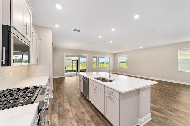 9865 SW 105th Ct, Ocala, FL 34481 - kitchen with a sink, open floor plan, stainless steel appliances, decorative backsplash, and recessed lighting