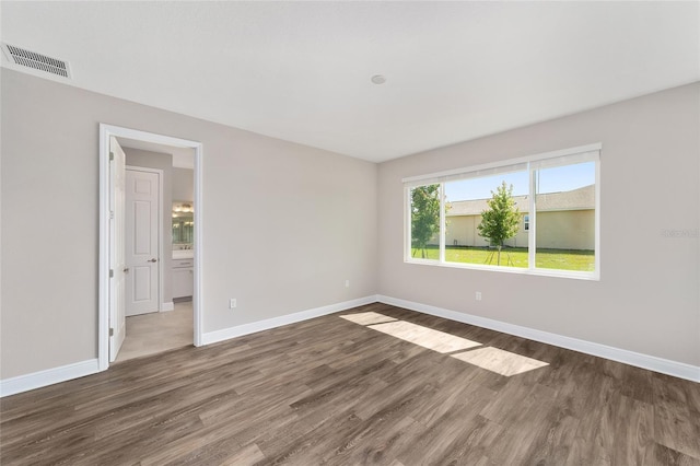 9865 SW 105th Ct, Ocala, FL 34481 - unfurnished room with wood finished floors and baseboards
