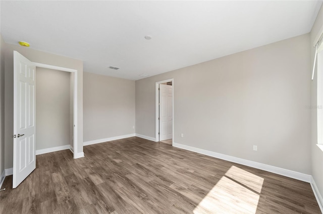 9865 SW 105th Ct, Ocala, FL 34481 - unfurnished room featuring wood finished floors, baseboards, and a smoke detector