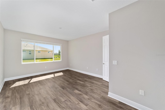 9865 SW 105th Ct, Ocala, FL 34481 - empty room featuring wood finished floors and baseboards