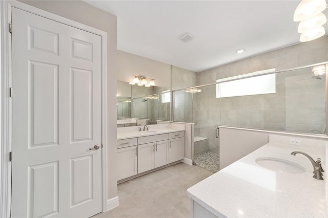 9865 SW 105th Ct, Ocala, FL 34481 - bathroom with two vanities, a shower stall, and tile patterned floors