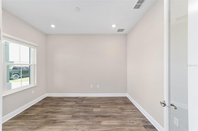 9865 SW 105th Ct, Ocala, FL 34481 - empty room with wood finished floors, baseboards, and recessed lighting