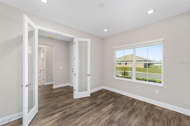 9865 SW 105th Ct, Ocala, FL 34481 - spare room with french doors, baseboards, dark wood-style flooring, and recessed lighting
