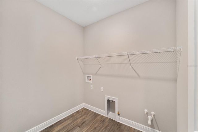 9865 SW 105th Ct, Ocala, FL 34481 - laundry room with hookup for a gas dryer, washer hookup, baseboards, and dark wood-type flooring