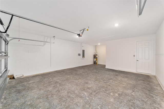 9865 SW 105th Ct, Ocala, FL 34481 - garage featuring water heater, electric panel, and a garage door opener