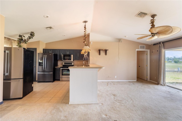 3019 NW Juanita Pl, Cape Coral, FL 33993 - kitchen with appliances with stainless steel finishes, a peninsula, lofted ceiling, a ceiling fan, and light countertops