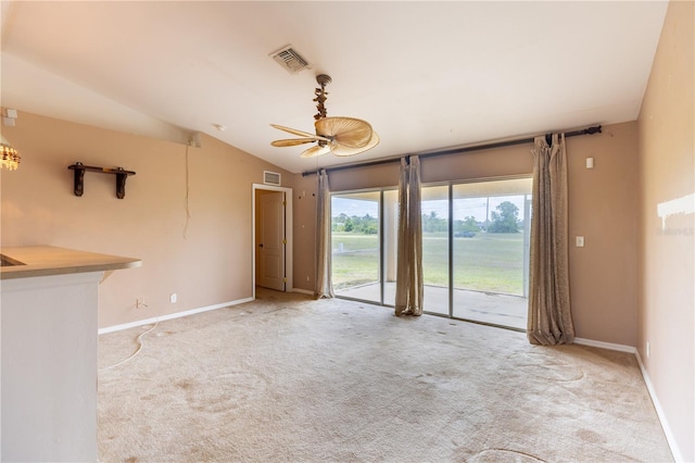 3019 NW Juanita Pl, Cape Coral, FL 33993 - unfurnished living room with carpet, vaulted ceiling, and baseboards