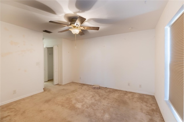 3019 NW Juanita Pl, Cape Coral, FL 33993 - empty room with light colored carpet, ceiling fan, and baseboards