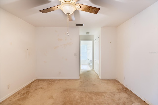 3019 NW Juanita Pl, Cape Coral, FL 33993 - empty room featuring light colored carpet, a ceiling fan, and baseboards