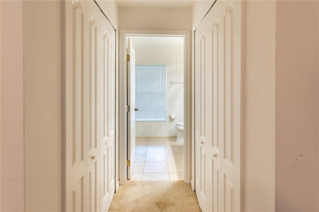 3019 NW Juanita Pl, Cape Coral, FL 33993 - hallway with light tile patterned floors and light colored carpet