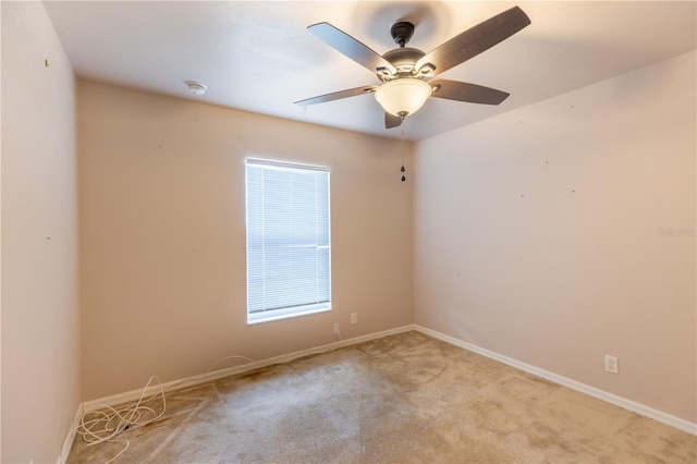 3019 NW Juanita Pl, Cape Coral, FL 33993 - empty room with carpet floors, baseboards, ceiling fan, and a smoke detector