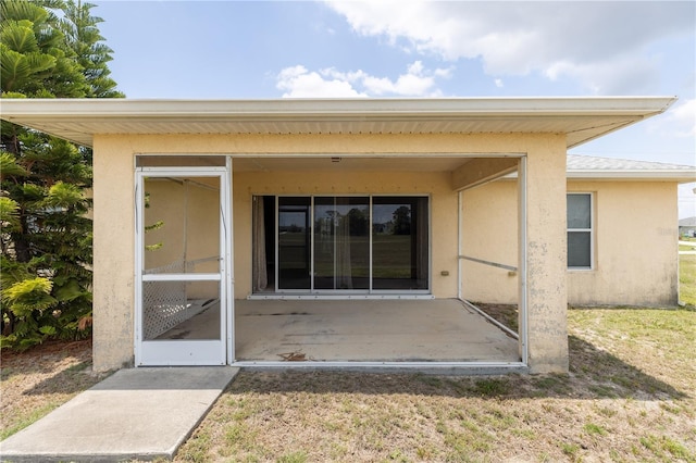 3019 NW Juanita Pl, Cape Coral, FL 33993 - back of house with stucco siding and a yard