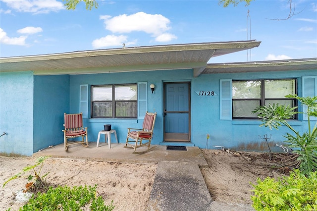 17128 SE 140th Ave, Weirsdale, FL 32195 - entrance to property with covered porch and stucco siding