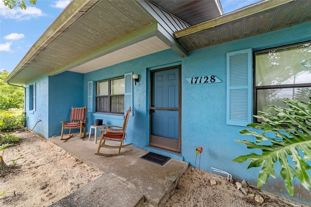 17128 SE 140th Ave, Weirsdale, FL 32195 - doorway to property featuring stucco siding