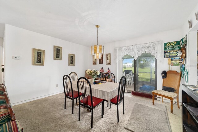 17128 SE 140th Ave, Weirsdale, FL 32195 - dining space featuring a chandelier and light colored carpet